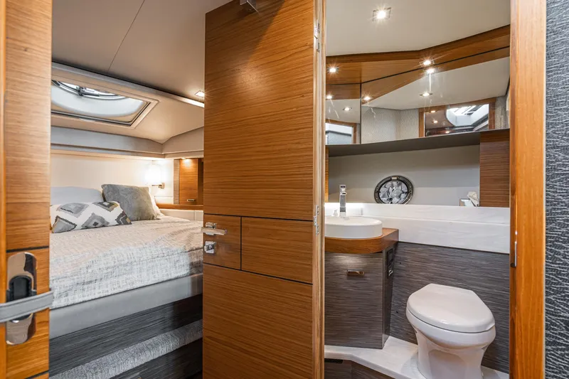 Slide: The Image of Luxurious interior of 2020 Tiara Yachts 39 Coupe, featuring a cozy bedroom and modern bathroom. - 33