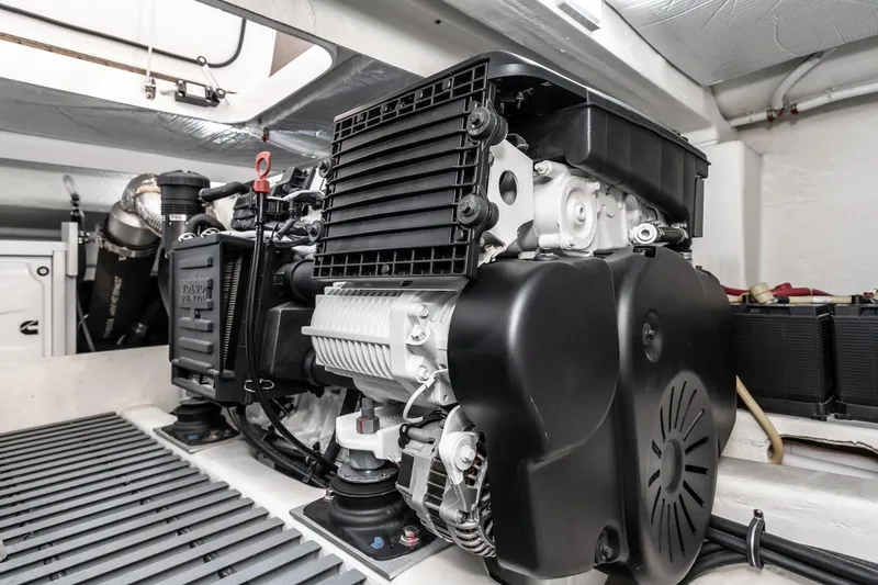 Slide: The Image of Engine room of 2020 Tiara Yachts 39 Coupe, showcasing modern marine engine components. - 46