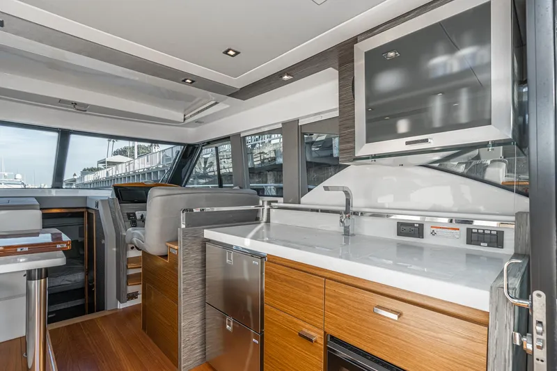 Slide: The Image of Luxurious interior of 2020 Tiara Yachts 39 Coupe with modern kitchen and helm station. - 9