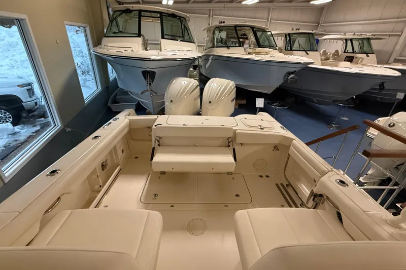 Slide: The Image of Interior view of a 2026 Grady-White Freedom 285 boat in showroom. - 10