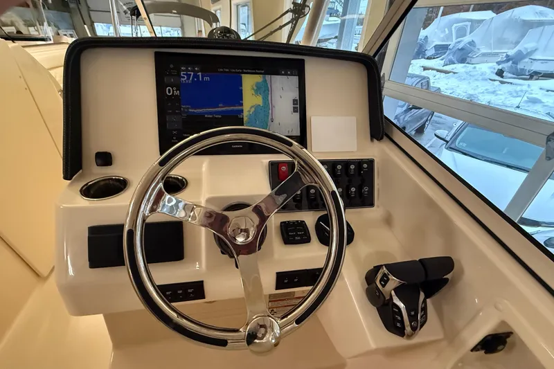 Slide: The Image of Helm console of Grady-White Freedom 285, year 2026. - 14