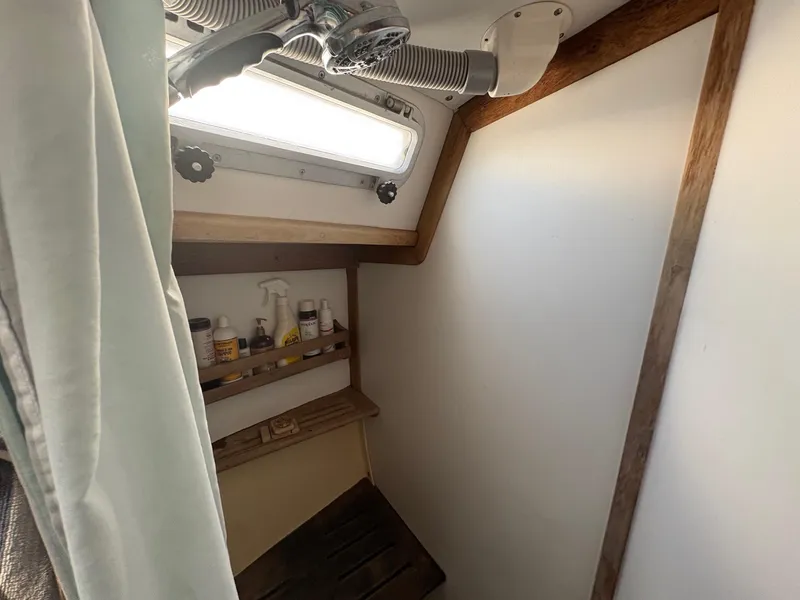 Slide: The Image of Interior of 1984 Freedom 39 Pilothouse boat with storage shelves and ventilation. - 18