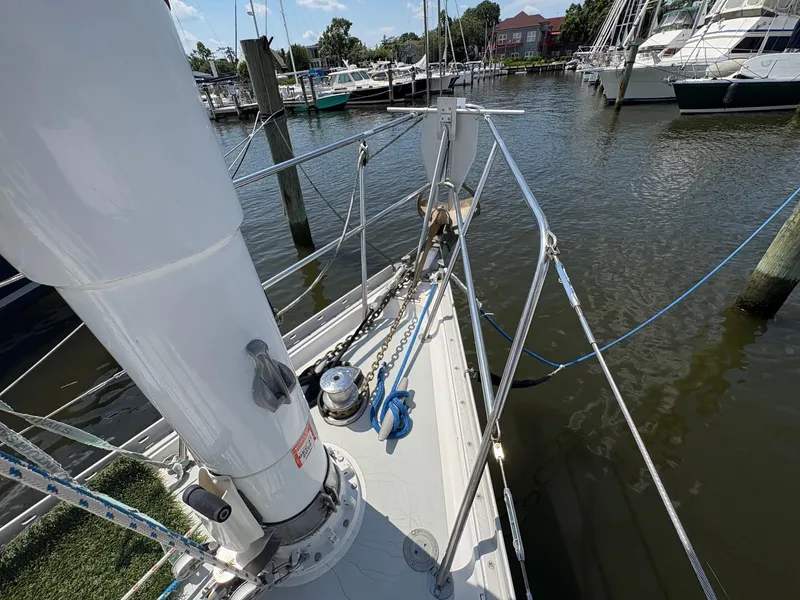 Slide: The Image of 1984 Freedom 39 Pilothouse sailboat docked at marina, showing deck and mast details. - 36