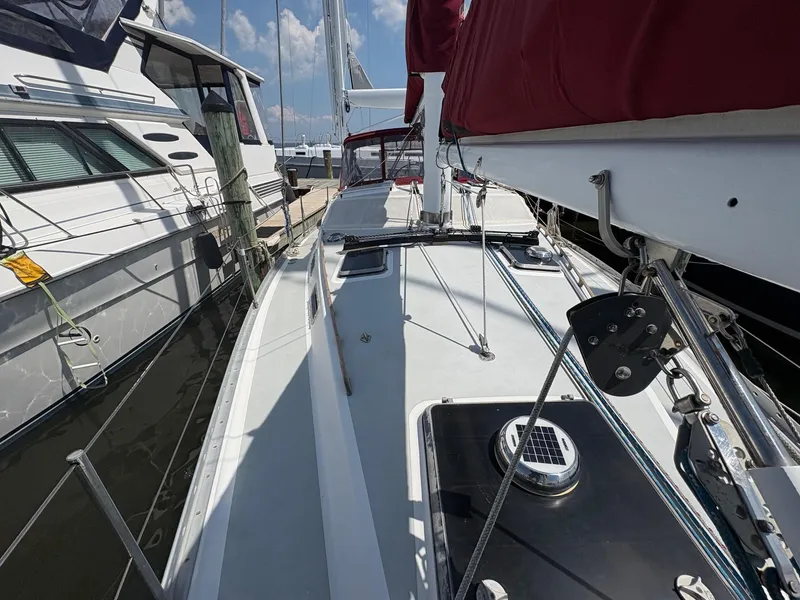 Slide: The Image of 1984 Freedom 39 Pilothouse sailboat docked, showcasing deck and rigging details. - 37