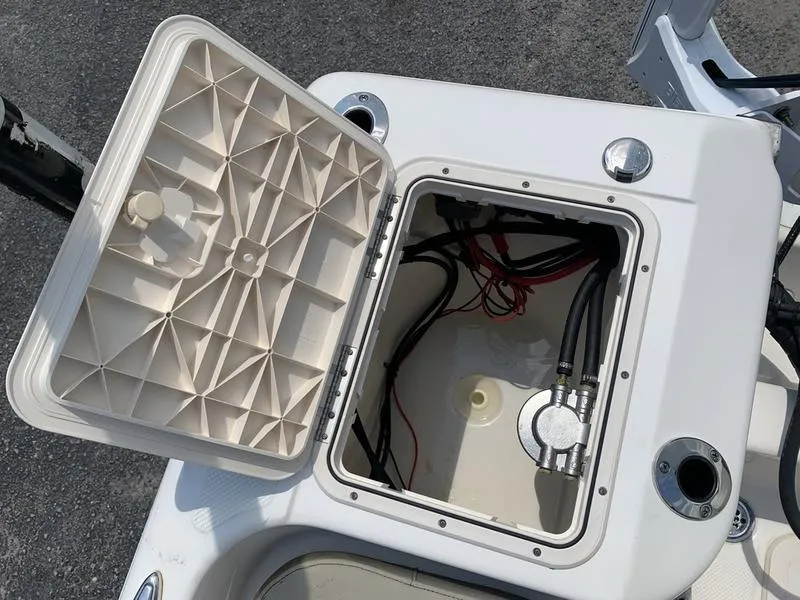 Slide: The Image of Open hatch of a 2021 Key West 176cc boat showing internal wiring and components. - 12