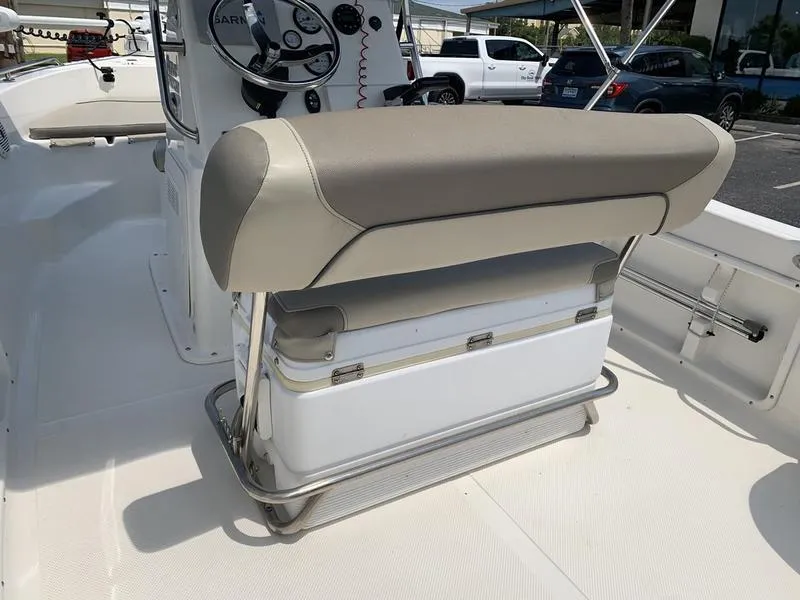 Slide: The Image of 2021 Key West 176cc boat interior with cushioned seating and steering console. - 13