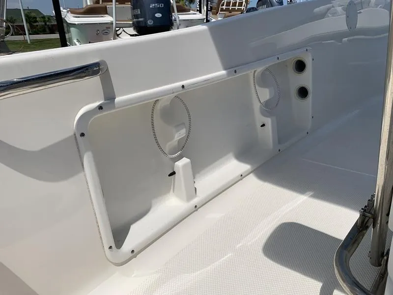 Slide: The Image of 2021 Key West 176cc boat interior with storage compartment and stainless steel railing. - 15