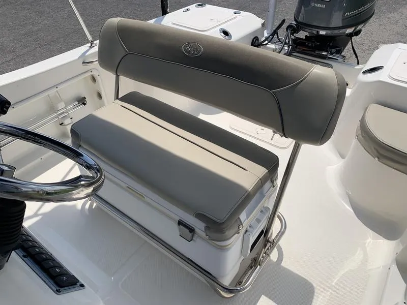 Slide: The Image of 2021 Key West 176cc boat interior with cushioned seating and steering wheel. - 16