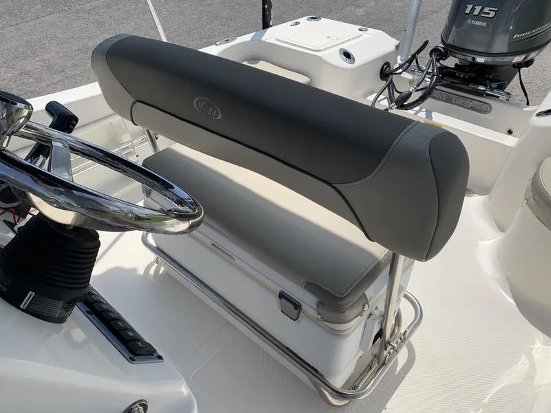 Slide: The Image of 2021 Key West 176cc boat interior with steering wheel and seating. - 17