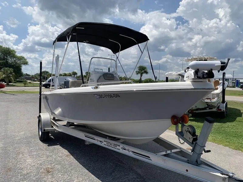 Slide: The Image of 2021 Key West 176cc boat on trailer under cloudy sky. - 6