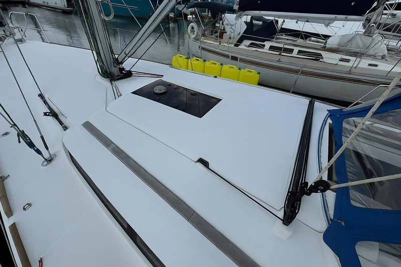 Slide: The Image of 2015 Jeanneau 409 sailboat deck with rigging and yellow fuel containers. - 17