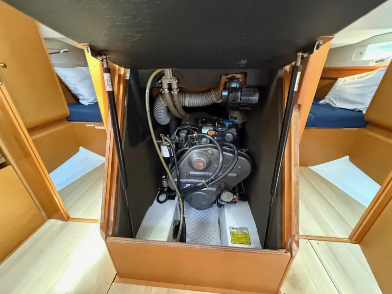 Slide: The Image of Engine compartment of a 2015 Jeanneau 409 sailboat, showcasing mechanical components. - 31
