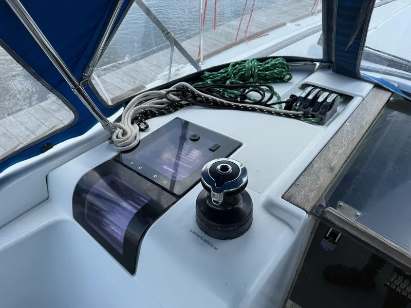 Slide: The Image of Cockpit of 2015 Jeanneau 409 sailboat with winch, ropes, and control panel. - 9