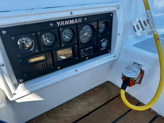 Slide: The Image of Control panel of a 1986 Hunter Legend 45 sailboat with Yanmar engine gauges. - 13