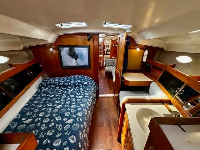 Slide: The Image of Interior of 1986 Hunter Legend 45 sailboat with cozy cabin and nautical decor. - 19