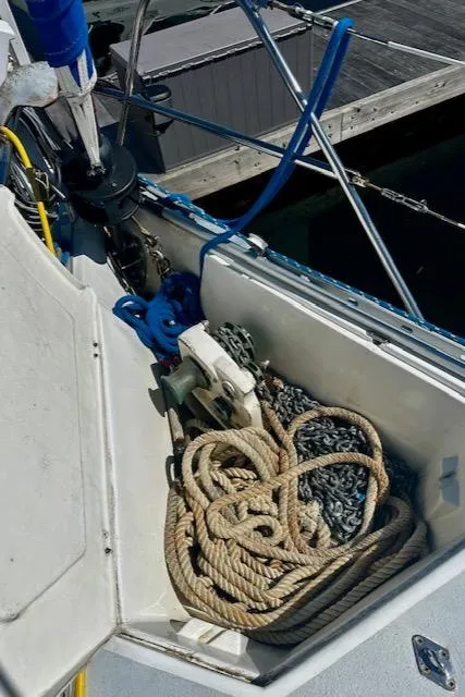 Slide: The Image of Anchor locker of 1986 Hunter Legend 45 sailboat with ropes and chains. - 26