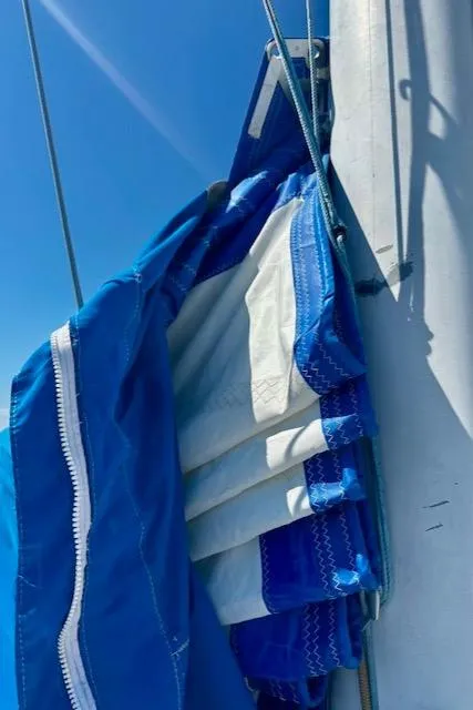 Slide: The Image of Blue sail on a 1986 Hunter Legend 45 yacht against a clear sky. - 28