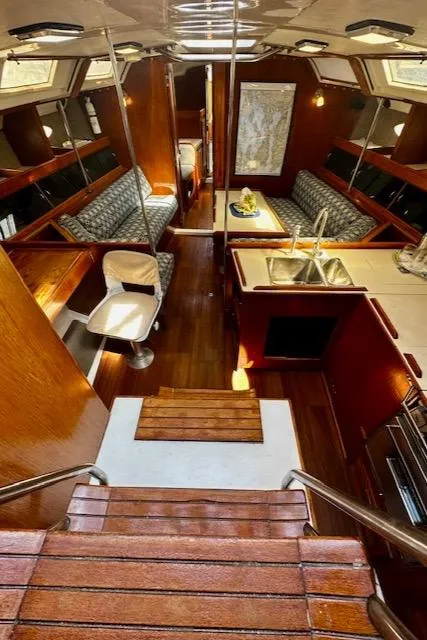 Slide: The Image of Interior of 1986 Hunter Legend 45 sailboat with wood finishes and seating area. - 30
