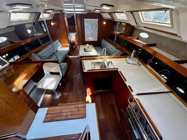 Slide: The Image of Interior of 1986 Hunter Legend 45 sailboat with wood finish and modern amenities. - 4