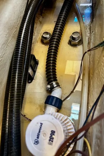 Slide: The Image of Bilge area of 1986 Hunter Legend 45 sailboat with hoses and wiring. - 40