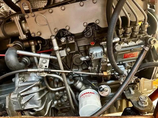 Slide: The Image of Engine of a 1986 Hunter Legend 45 sailboat, featuring Yanmar components and intricate mechanical details. - 41