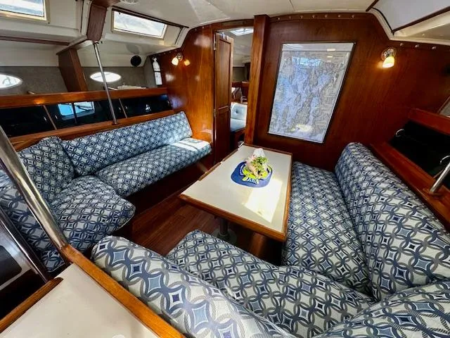 Slide: The Image of Interior of 1986 Hunter Legend 45 yacht with patterned seating and wooden finishes. - 5