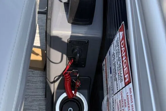 Slide: The Image of Control panel of 2026 Bennington M Quad Bench 24 MFB with safety warning label. - 21