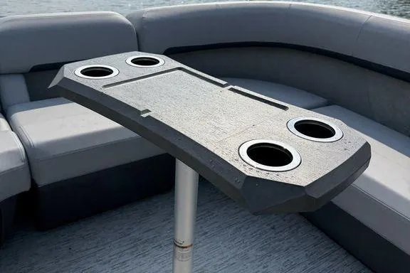 Slide: The Image of 2026 Bennington M Quad Bench 24 MFB with cup holders on a pontoon boat. - 7