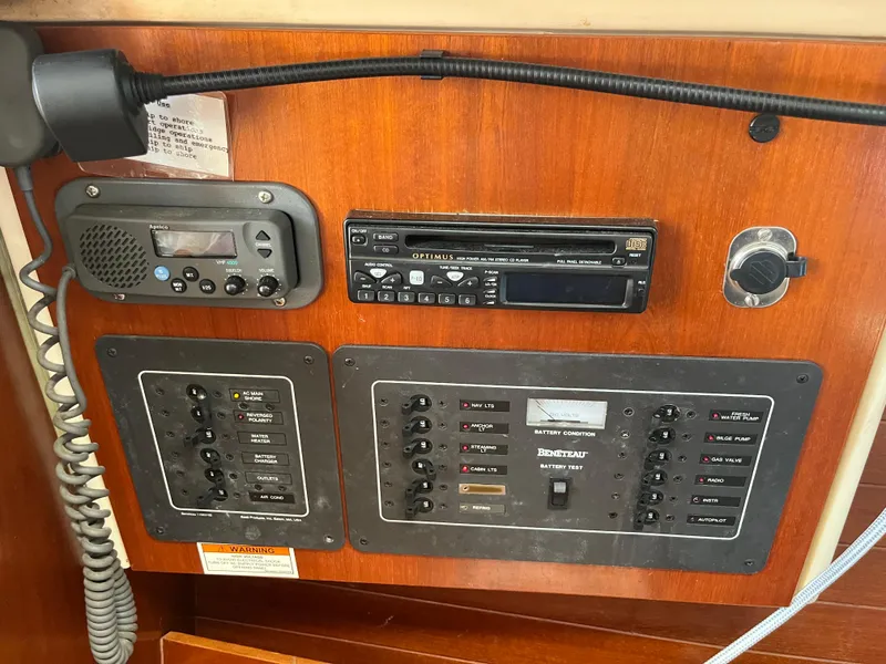 Slide: The Image of Control panel of a 1998 Beneteau 321 sailboat with radio and electrical switches. - 20