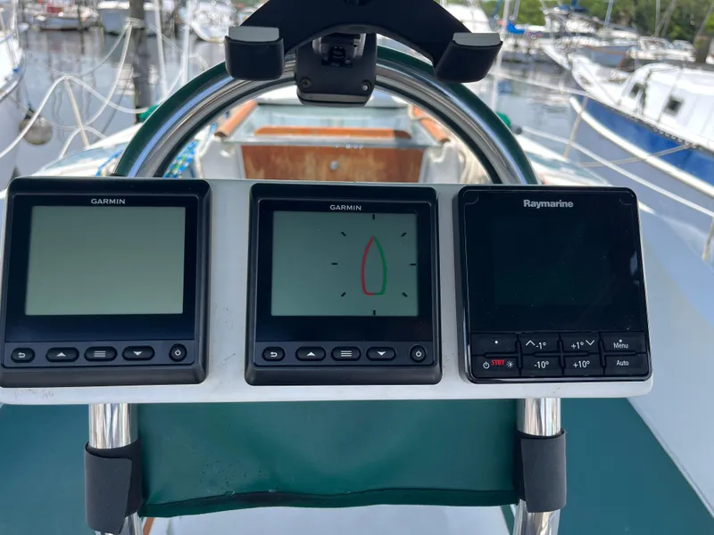 Slide: The Image of Beneteau 321 yacht cockpit with Garmin and Raymarine navigation displays, 1998 model. - 4