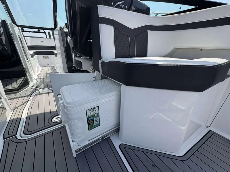 Slide: The Image of 2021 Monterey 255 Super Sport interior with Igloo cooler under seat. - 11