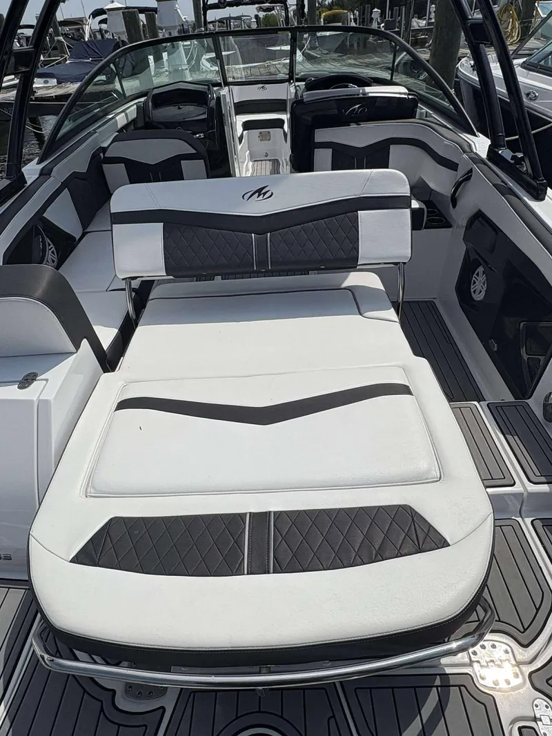 Slide: The Image of 2021 Monterey 255 Super Sport boat interior with luxurious seating and sleek design. - 18