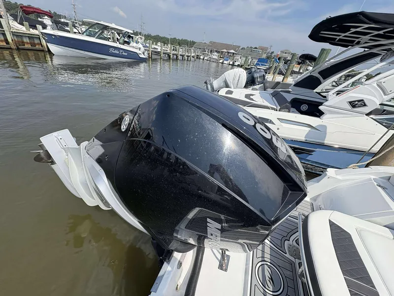 Slide: The Image of 2021 Monterey 255 Super Sport boat docked with powerful outboard motor. - 19