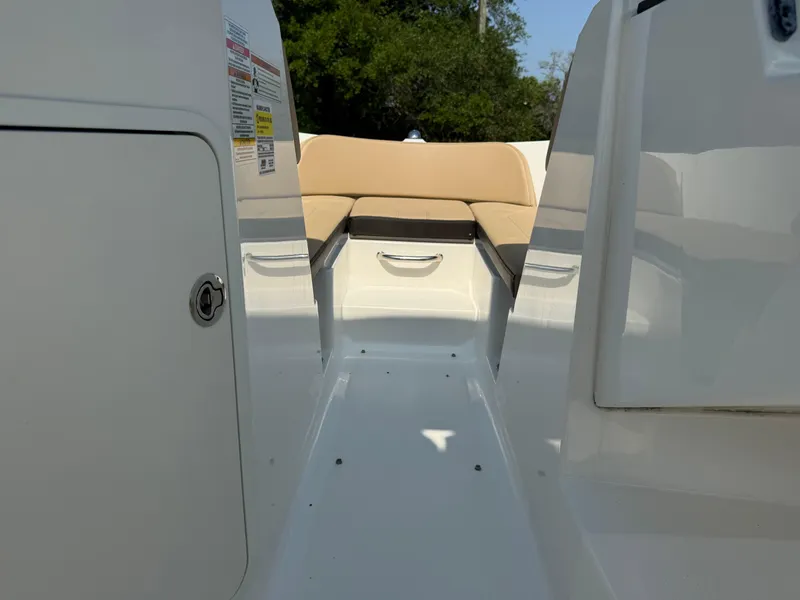 Slide: The Image of Interior view of a 2019 Sea Ray 21SPX boat with beige seating and white deck. - 11