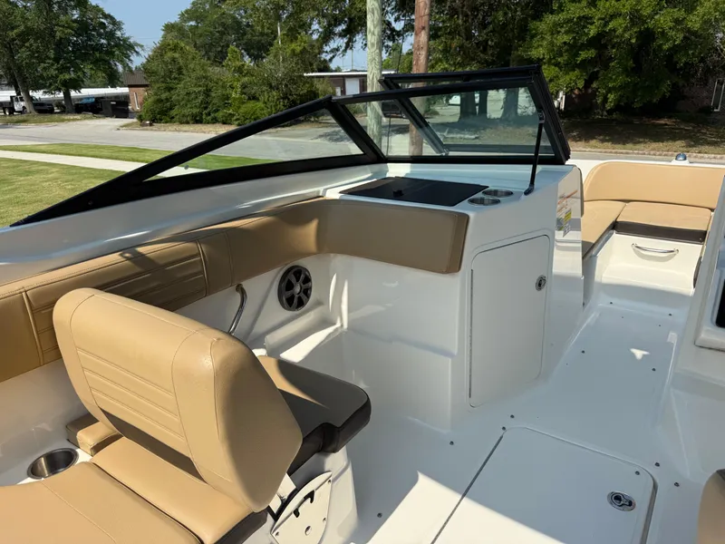 Slide: The Image of 2019 Sea Ray 21SPX boat interior with tan seating and sleek design. - 13