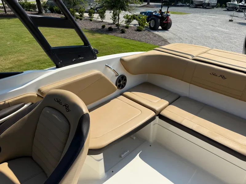 Slide: The Image of 2019 Sea Ray 21SPX boat interior with tan leather seating and sleek design. - 17