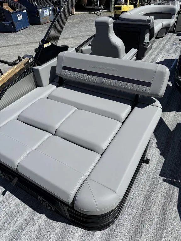 Slide: The Image of 2026 Bennington M Swingback 24 MSB pontoon boat interior with seating and helm. - 12