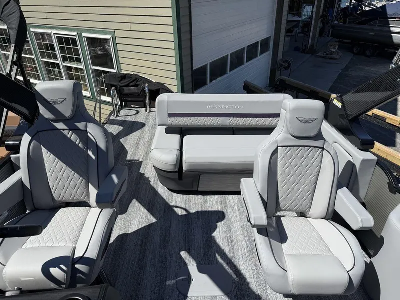 Slide: The Image of 2026 Bennington M Swingback 24 MSB boat interior storage compartment open, revealing wiring and components. - 13