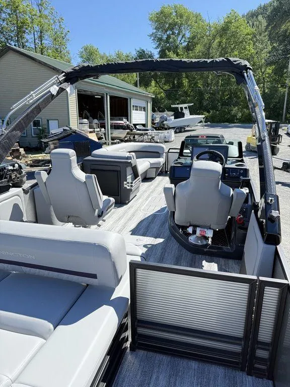 Slide: The Image of 2026 Bennington M Swingback 24 MSB interior with gray seating and cup holders. - 14