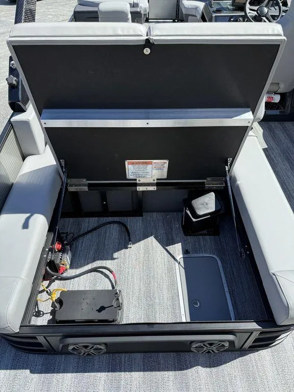 Slide: The Image of 2026 Bennington M Swingback 24 MSB boat interior with steering controls and seating. - 15