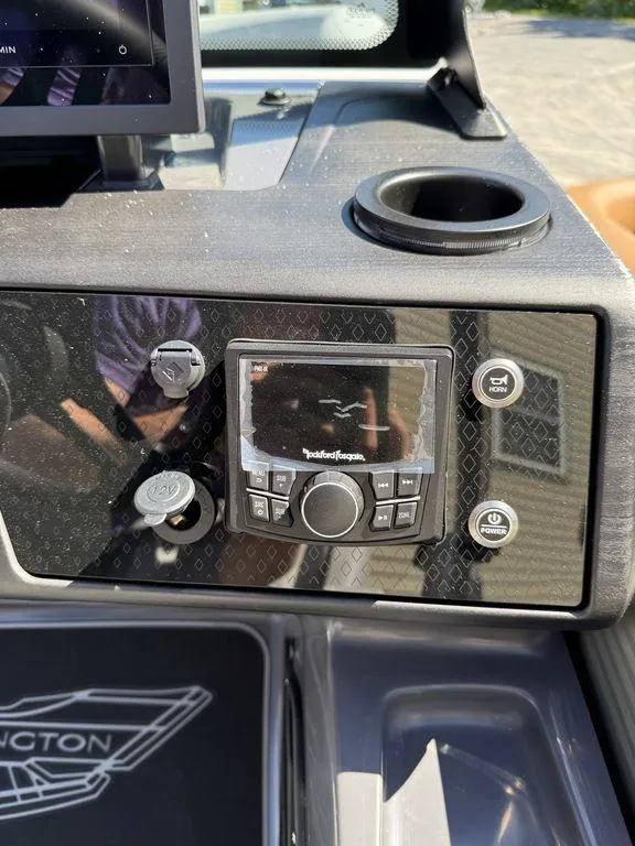 Slide: The Image of 2026 Bennington M Swingback 24 MSB dashboard with steering wheel and control panel. - 19