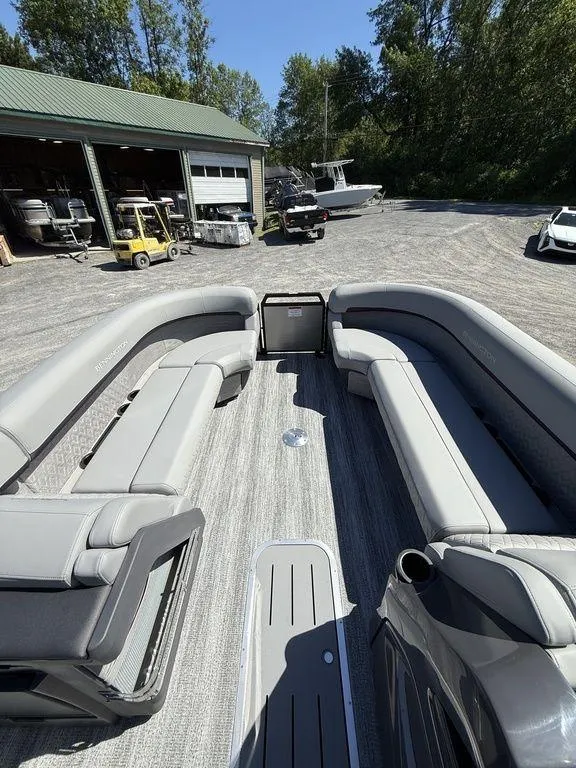 Slide: The Image of 2026 Bennington M Swingback 24 MSB dashboard with control panel and cup holder. - 20