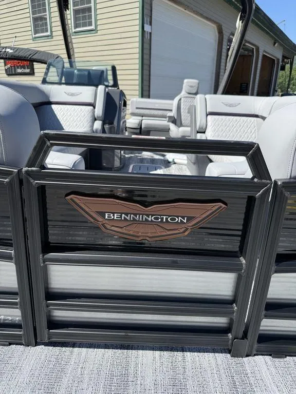 Slide: The Image of Storage compartment of 2026 Bennington M Swingback 24 MSB pontoon boat, featuring interior equipment. - 21