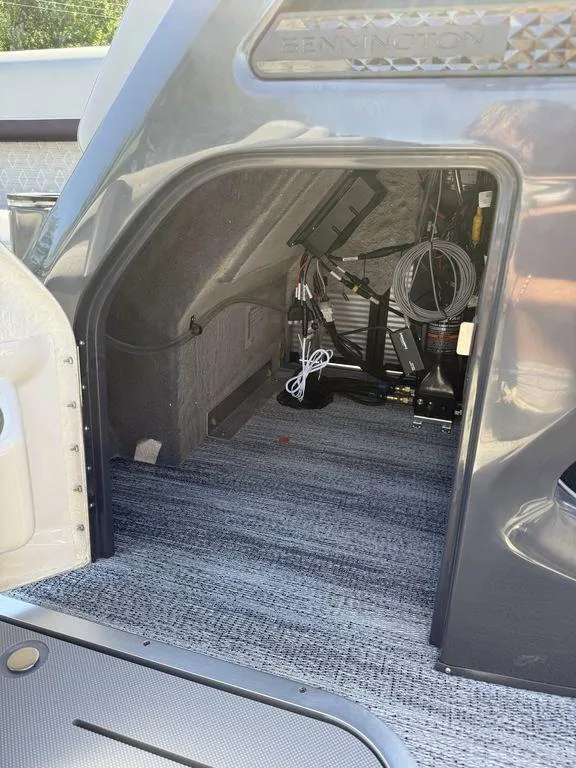 Slide: The Image of 2026 Bennington M Swingback 24 MSB boat interior, featuring sleek design and modern controls. - 22