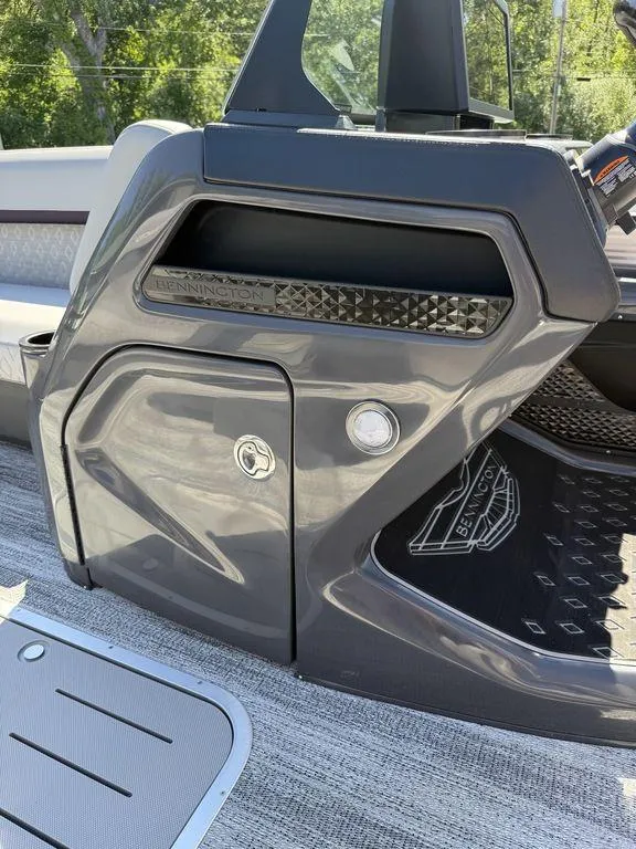 Slide: The Image of 2026 Bennington M Swingback 24 MSB boat interior with sleek seating design. - 24