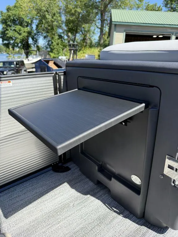 Slide: The Image of 2026 Bennington M Swingback 24 MSB pontoon boat interior with gray seating and cup holders. - 30