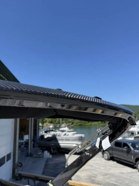 Slide: The Image of 2026 Bennington M Swingback 24 MSB boat interior with luxurious seating and scenic lake view. - 34