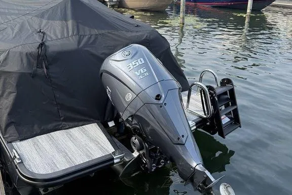 Slide: The Image of 2026 Bennington RX Sport Quad Bench 23 RXFB with powerful 350 V6 engine, docked. - 17