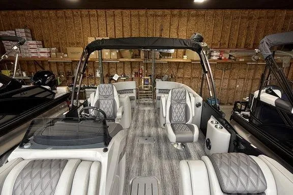 Slide: The Image of 2026 Bennington RX Sport Quad Bench 23 RXFB interior with luxurious seating and modern design. - 28