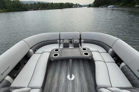 Slide: The Image of 2026 Bennington RX Sport Quad Bench 23 RXFB on a serene lake. - 7
